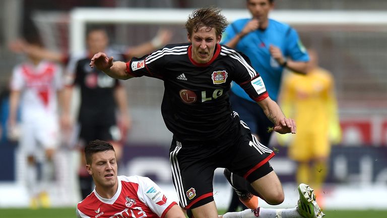 COLOGNE, GERMANY - APRIL 25:  Stefan Kiessling of Leverkusen is brought down by Kevin Wimmer of Koeln 