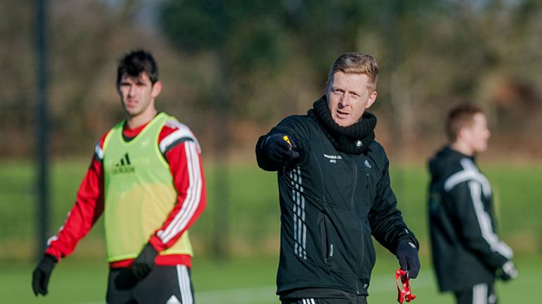 SWANSEA, WALES - JANUARY 21: L-R Nelson Oliveira looks on as manager Garry Monk gives instructions during the Swansea City Training Session on January 21, 