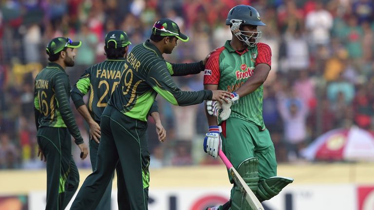 Pakistan captain Azhar Ali  congratulates Bangladesh cricketer Tamim Iqbal as he walks off 