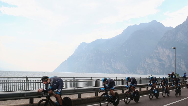 Team Sky leads his squad alongside Lake Garda during the 13.4km team time trial from Riva del Garda 
