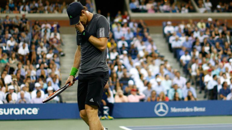 Andy Murray reacts against Novak Djokovic during their men's singles quarter-final at the 2014 US Open