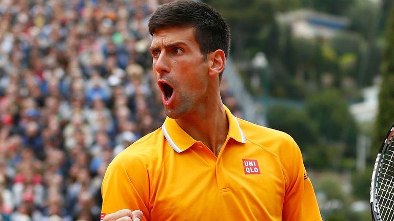 Novak Djokovic celebrates winning a game against Tomas Berdych in the final of the Monte Carlo Masters