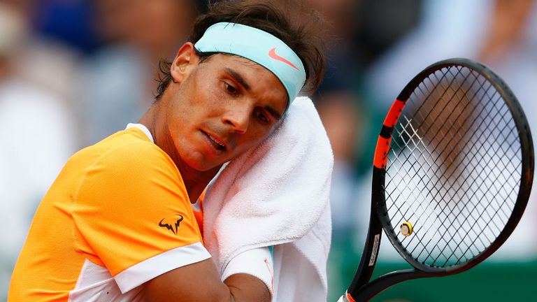 Rafael Nadal  wipes his face in his match against Novak Djokovic in the semi-finals of the Monte Carlo Masters