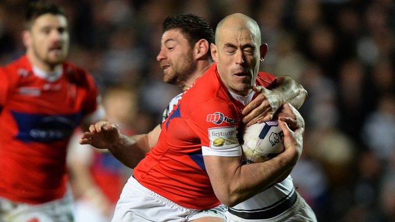 Hull Kingston Rovers' Terry Campese drives past Hull FC's Mark Minichiello to score a try during the First Utility Super League match at the KC Stadium