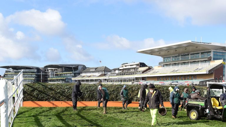 Groundstaff prepare the approach to The Chair before the Crabbie's Grand National