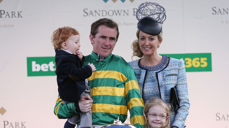 Tony McCoy with his wife Chanelle and children Eve and Archie after being presented with the Chamipon Jockey trophy