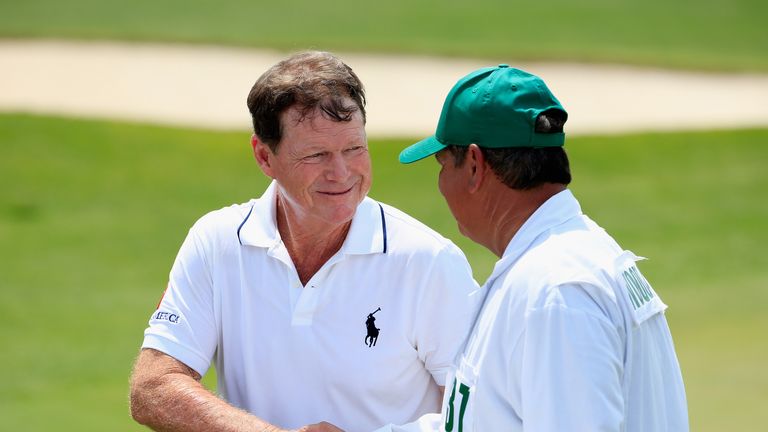 Tom Watson of the United States (L) shakes hands with caddie Tony Navarro during the first round of the 2015 Masters Tournament at