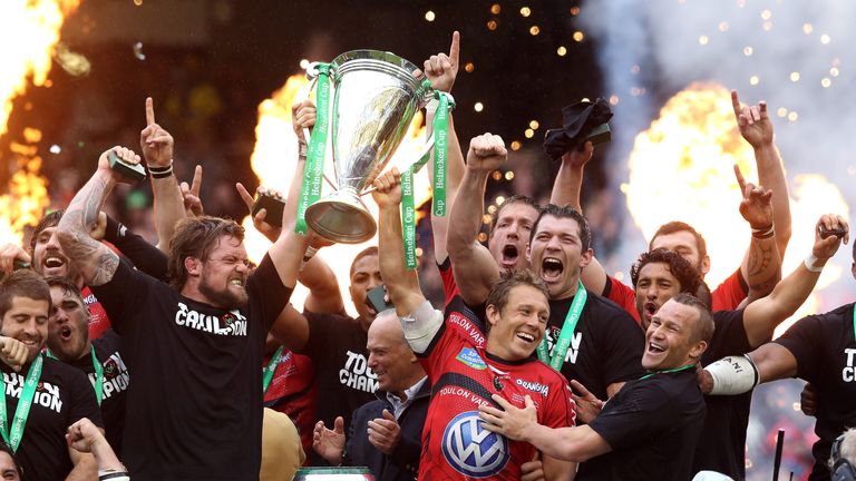 Jonny Wilkinson (R) and Joe van Niekerk of Toulon raise the Heineken Cup after their victory over Clermont