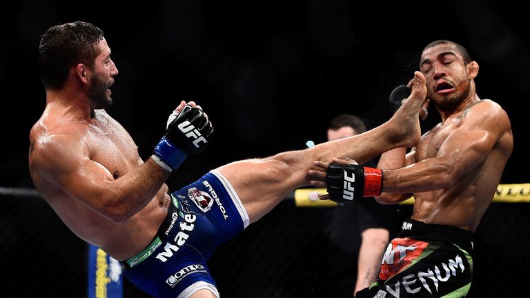 RIO DE JANEIRO, BRAZIL - OCTOBER 25: Chad Mendes of the United States kicks Jose Aldo of Brazil in their featherweight championship bout during the UFC 179