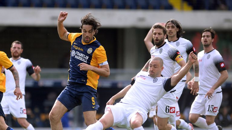 Luca Toni is challenged by Daniele Capelli