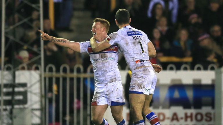 Wakefield Wildcats' Chris Riley (left) and Craig Hall celebrate after the final whistle against Castleford Tigers'.