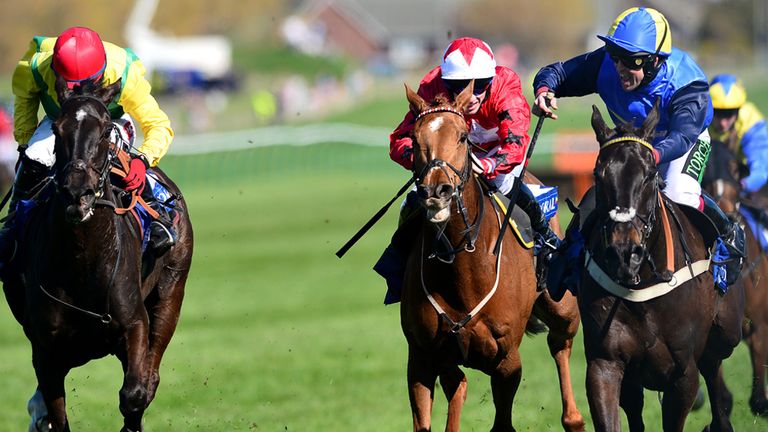 Wayward Prince (right) sticks his neck out to win the Coral Scottish Grand National