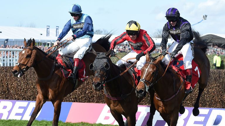 Duke of Lucca (centre) ridden by Richard Johnson clears the final fence to win The Betfred Handicap Steeple Chase