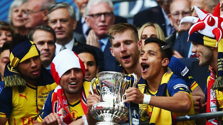 Alexis Sanchez with the FA Cup