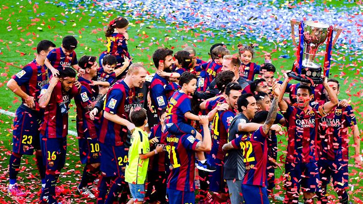 Barcelona players celebrate with the La Liga trophy