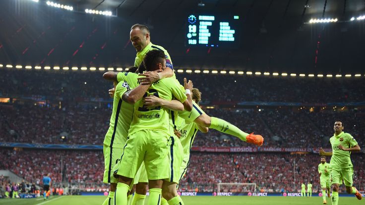 Neymar is mobbed by his Barcelona team-mates after scoring at the Allianz Arena