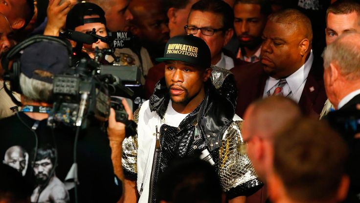 Floyd Mayweather Jr. throws a right at Manny Pacquiao during their welterweight unification championship MGM Grand Garden Arena in Las Vegas