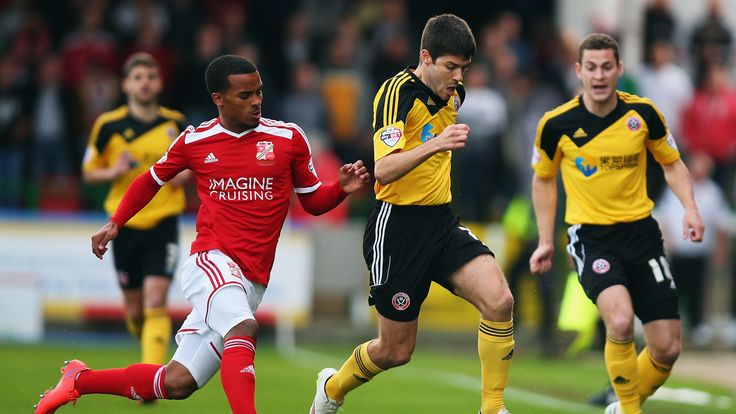 Swindon's Nathan Byrne tracks Sheffield United's Ryan Flynn