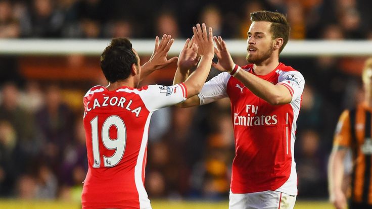 HULL, ENGLAND - MAY 04:  Aaron Ramsey of Arsenal (16) celebrates with Santi Cazorla as he scores their second goal during the Barclays Premier League match