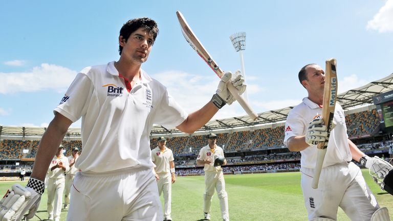 England batsman Alastair Cook (L) and Jonathan Trott (R) acknowledge the applause after compiling a 329 run partnership as England declares at 517-1 on the