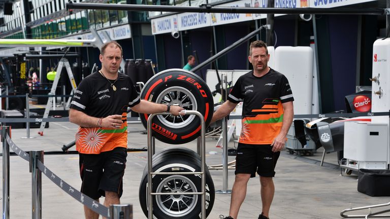 Force India mechanics with Pirelli tyres