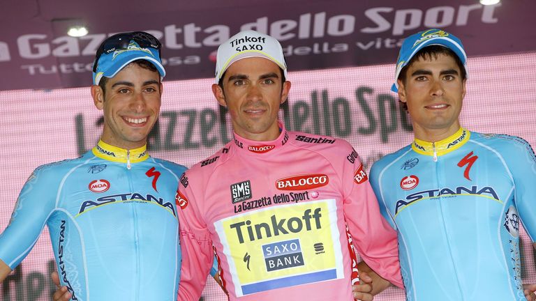 Alberto Contador (C), Fabio Aru (L) and third placed winner Spain's Mikel Landa celebrate on the podium after the 98th Giro d'Italia, Tour of Italy