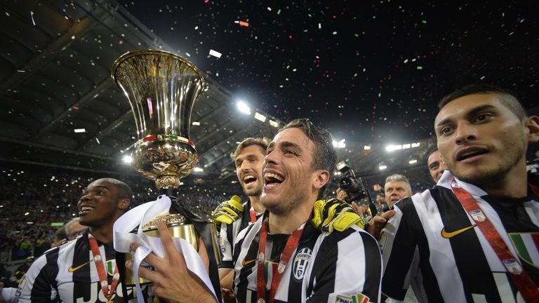 Alessandro Matri (C) celebrates with the trophy after the game