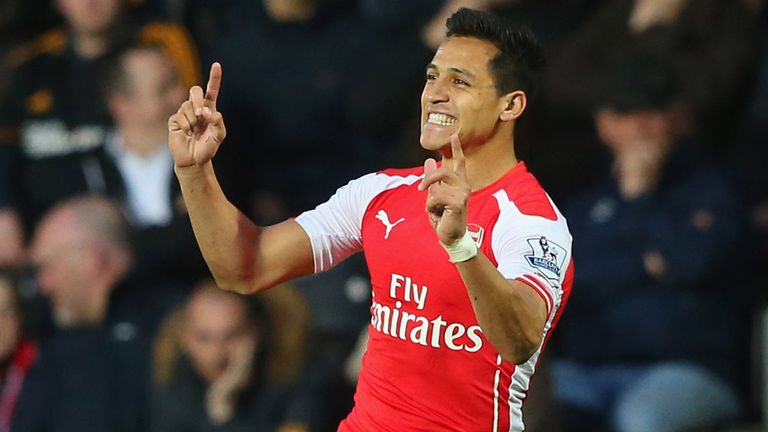 HULL, ENGLAND - MAY 04:  Alexis Sanchez of Arsenal celebrates as he scores their first goal during the Barclays Premier League match between Hull City and 