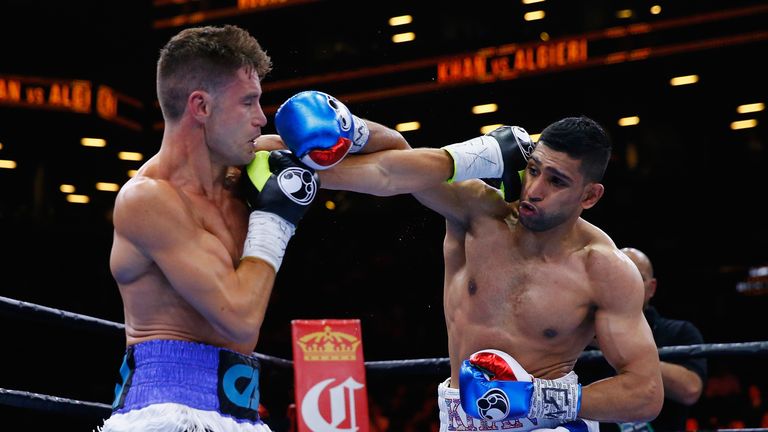 Chris Algieri punches Amir Khan during their Welterweight bout at Barclays Center of Brooklyn on May 29, 2015 in New York City