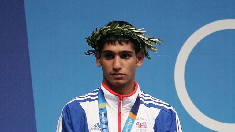 ATHENS - AUGUST 29:  Amir Khan of Great Britain receives his silver medal for the men's boxing 60 kg event on August 29, 2004 during the Athens 2004 Summer