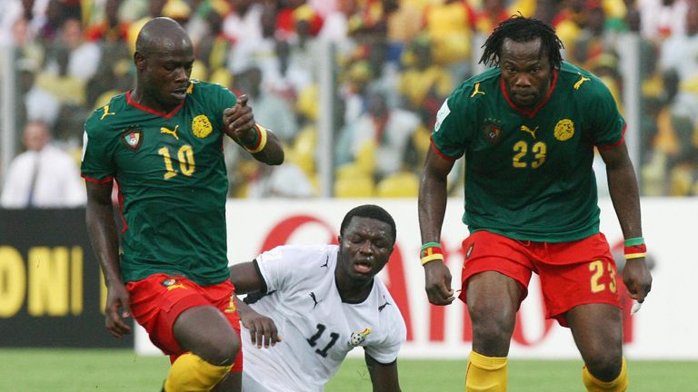Andre Bikey (right): The Cameroon defender was sent off after an altercation with a stretcher-bearer in 2008