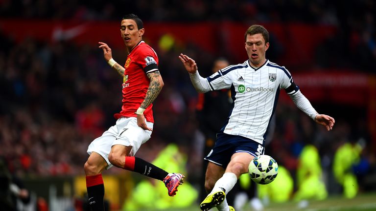 Angel Di Maria in action with West Brom's Craig Gardner