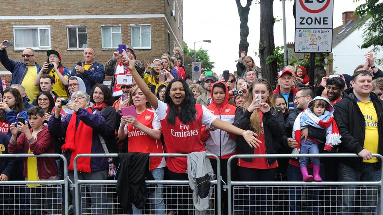Fans line the route of Arsenal's FA Cup trophy parade.