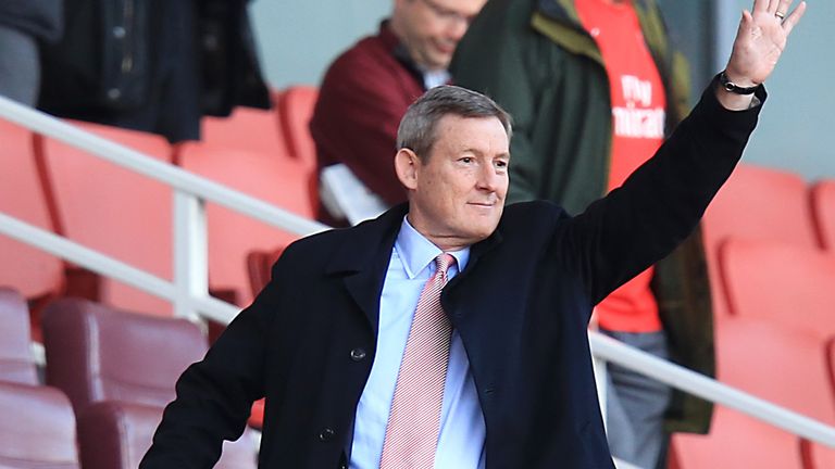 Sunderland owner Ellis Short waves from the stands during the Barclays Premier League match at the Emirates Stadium, London.