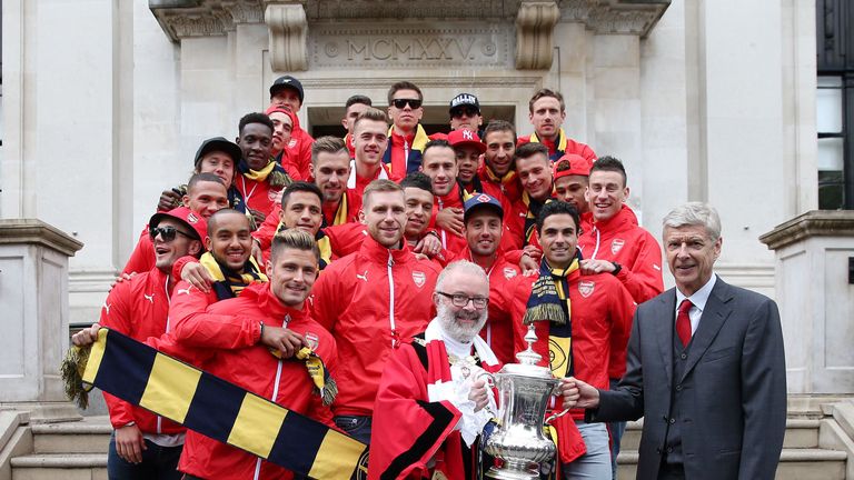 Arsene Wenger and his Arsenal team celebrate their FA Cup win at Islington Town Hall.