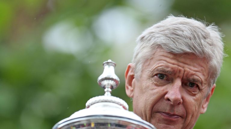 Arsenal manager Arsene Wenger with the FA Cup during their victory parade through London.