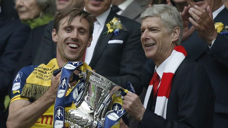Arsene Wenger lifts the FA Cup with Nacho Monreal