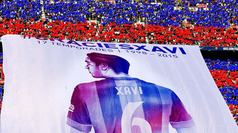 Barcelona fans display a huge banner tribute to Xavi 