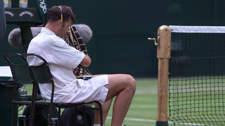 27 Jun 2001:  Barry Cowan of Great Britain listern's to his walkman in his five set match with Pete Sampras of the USA during the men's second round of The