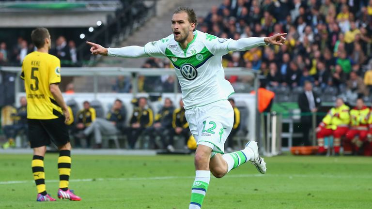 Bas Dost of VfL Wolfsburg celebrates after scoring his teams third goal during the DFB Cup Final match between Borussia Dortmund