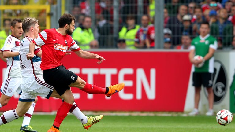 Admir Mehmedi of Freiburg scores against Bayern Munich