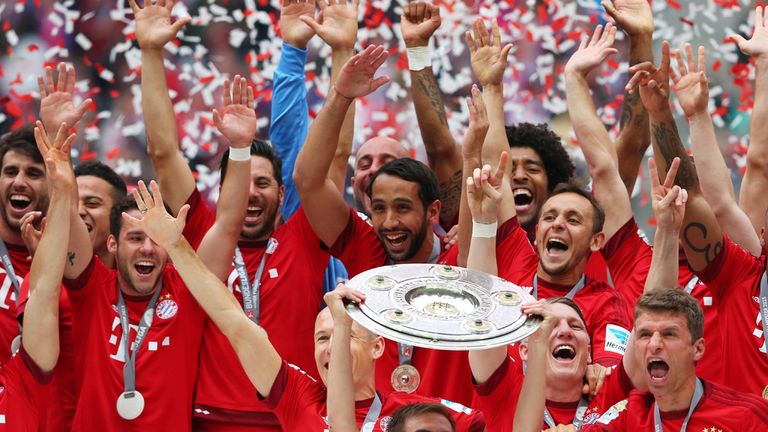 Bayern Munich celebrate with the Bundesliga trophy
