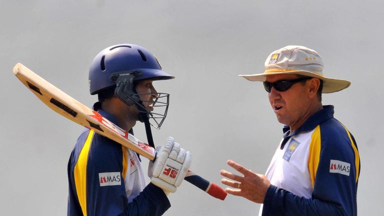 Sri Lankan cricketer Tilakratne Dilshan (L) chats with team coach Trevor Bayliss during a training session at The R Peremadasa Stadium in Colombo on Februa
