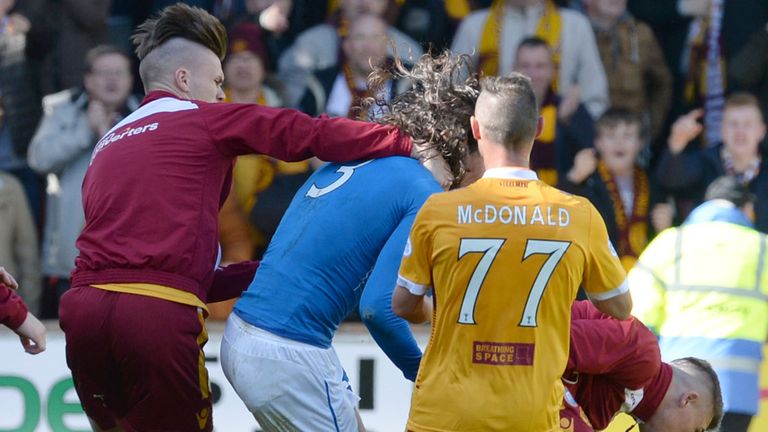 Rangers' Bilel Mohsni (centre) clashes with Motherwell players at full-time
