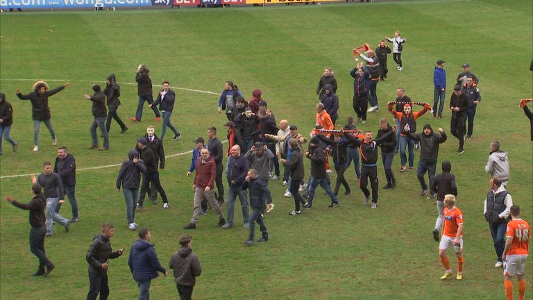 Blackpool fans invade the pitch at Bloomfield Road