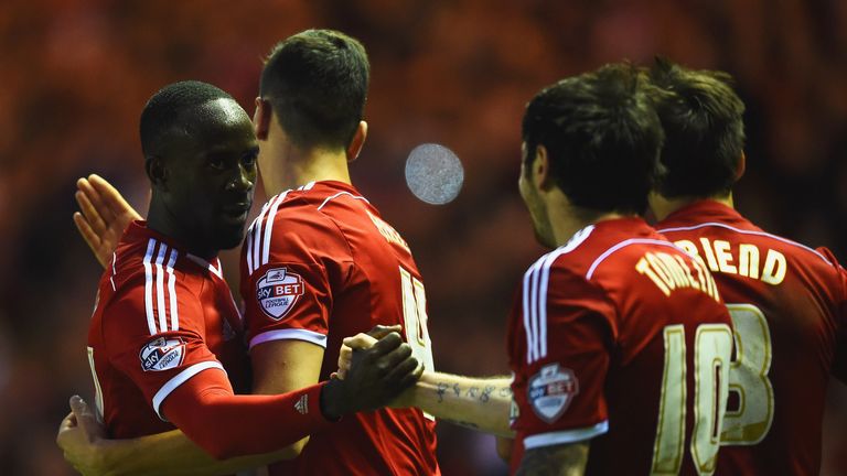 MIDDLESBROUGH, ENGLAND - MAY 15:  Albert Adomah of Middlesbrough (L) celebrates with Daniel Ayala (2L) and Lee Tomlin (10) as he scores their third goal du