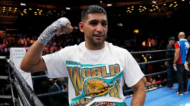 Amir Khan celebrates after defeating Chris Algieri during a boxing bout, Friday, May 29, 2015, in New York. Khan won by unanimous decision