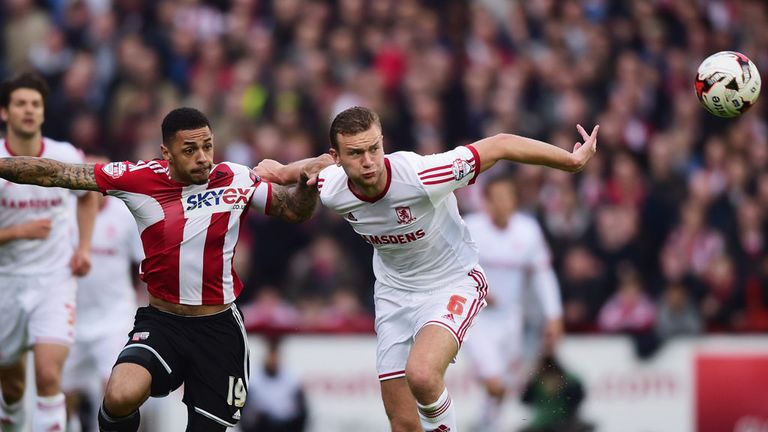 Andre Gray and Ben Gibson battle for the ball