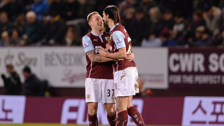 Burnley's George Boyd and Scott Arfield celebrate during the Premier League football match against Manchester City at Turf Moor on March 14, 2015. 