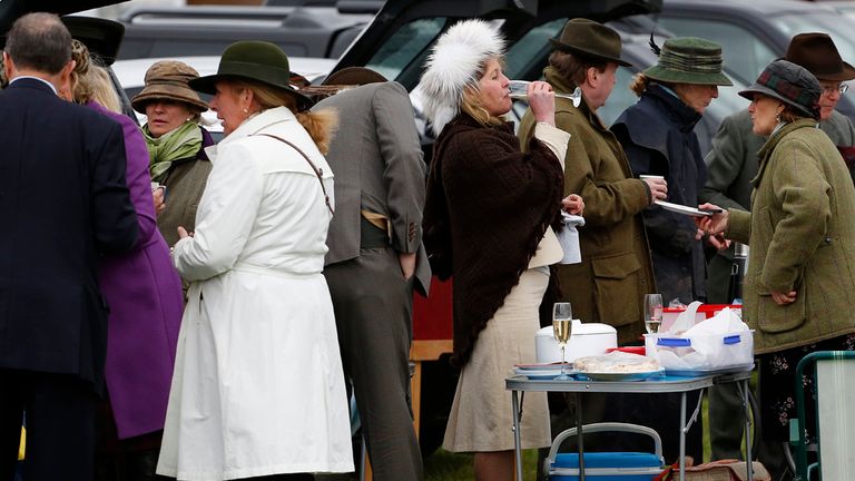 Racegoers share a picnic in the car park